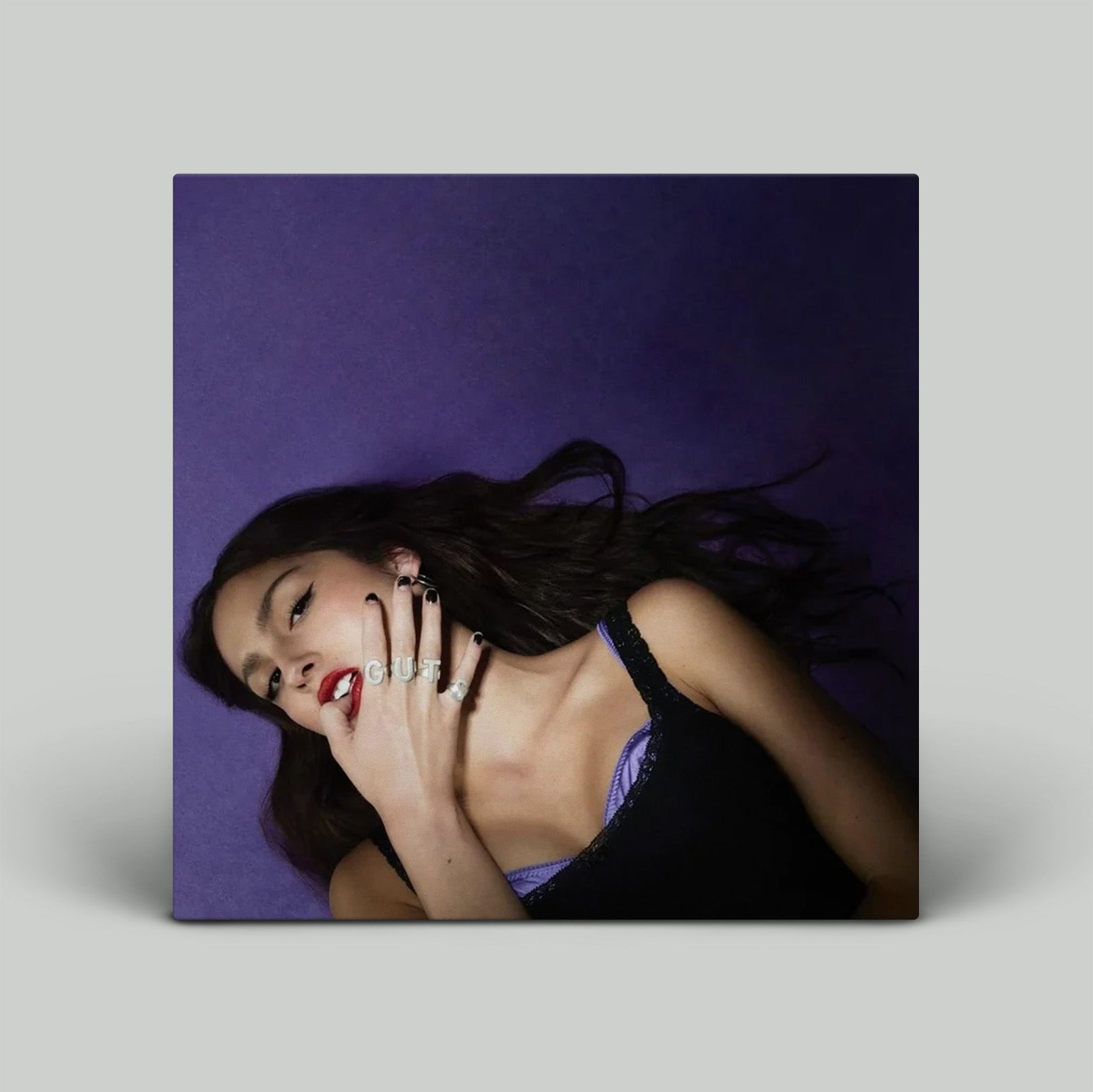 Woman with jewelry on a purple background