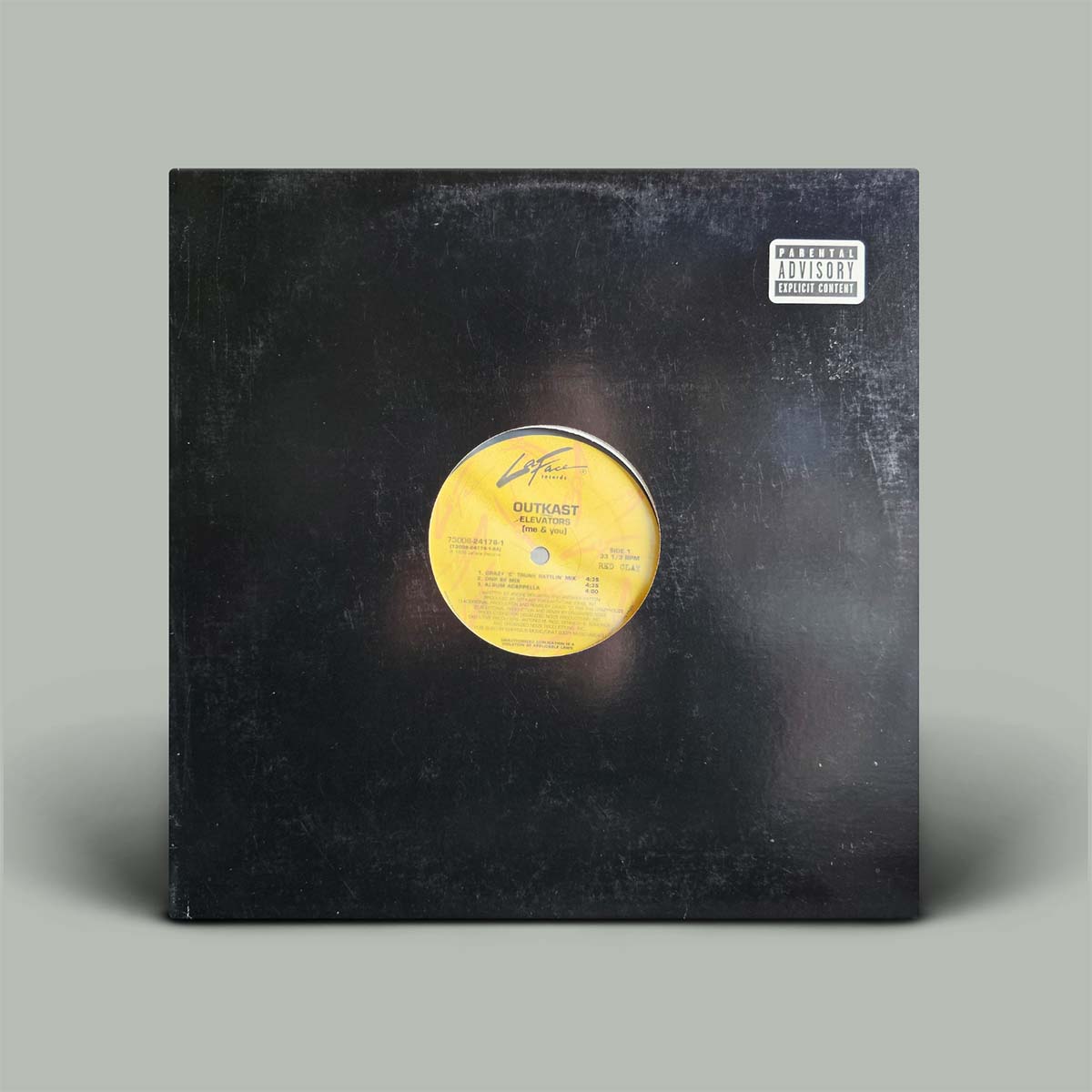 A vinyl record sleeve for Outkast's single, featuring a distressed black cover with a yellow center label and a Parental Advisory label in the top right corner, set against a solid gray background.