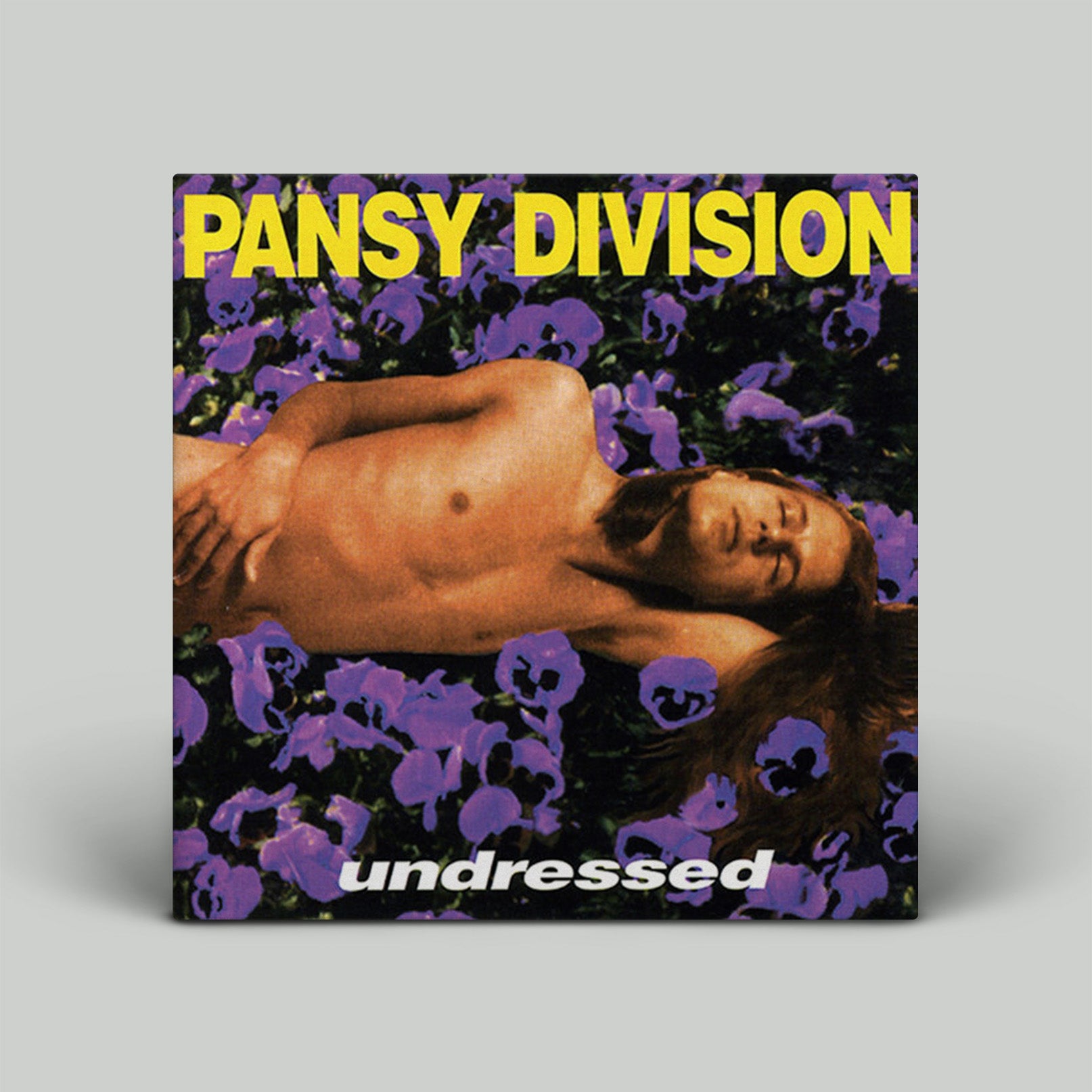 Album cover for 'undressed' by Pansy Division with a person lying on flowers.