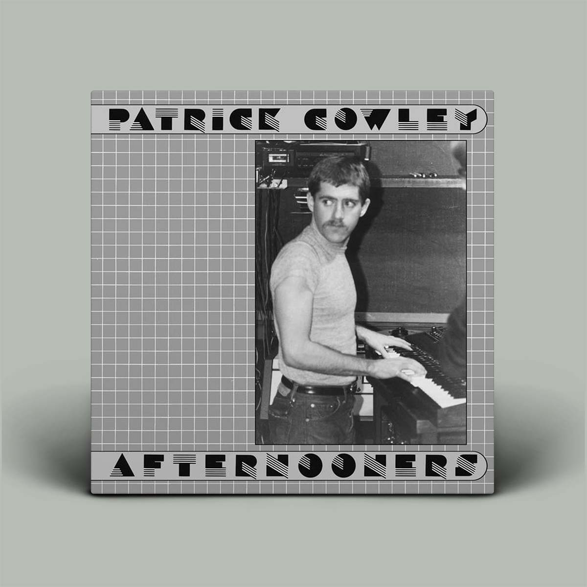 Album cover is grey with photo of man playing synth and the words Patrick Cowley and Afternooners on it.