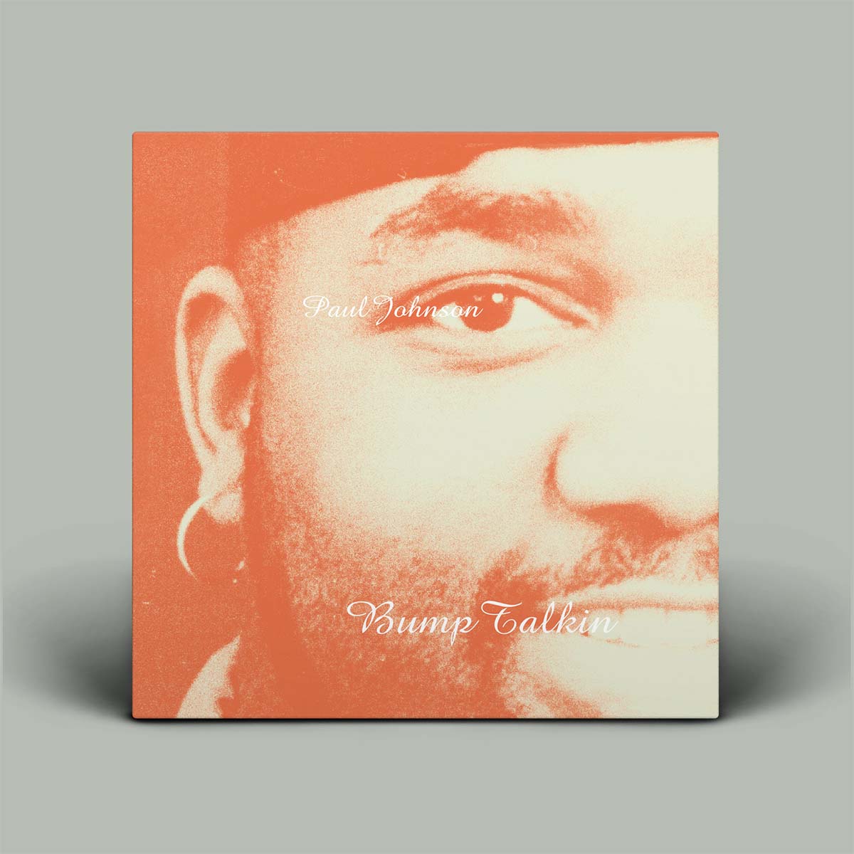 A square album cover or print featuring a close-up portrait of a man's face in warm orange and cream tones, with the text 'Paul Johnson' and 'Bump Talkin'' visible on the cover, shown against a light gray background.