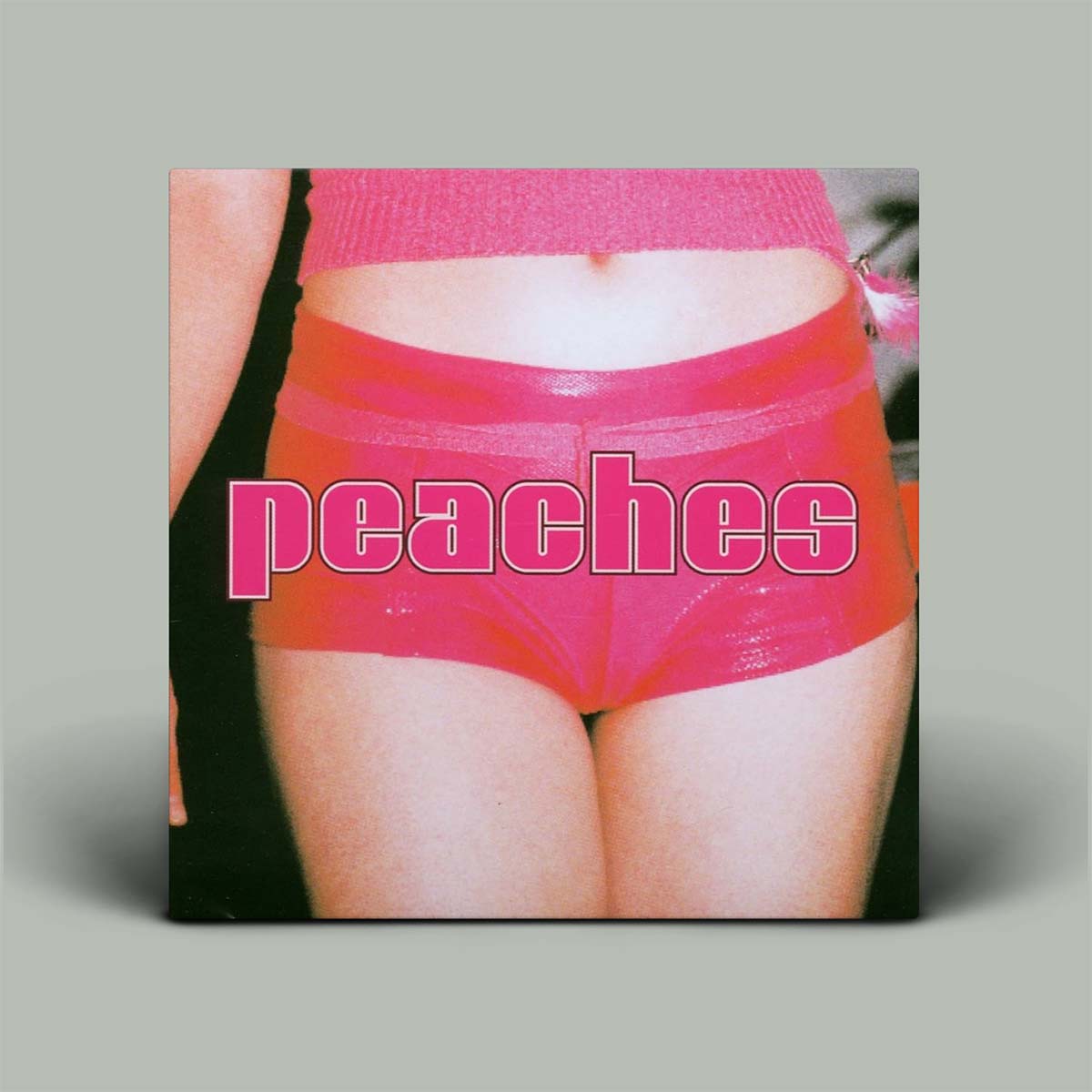 Album cover with pink underwear and 'peaches' text on a gray background