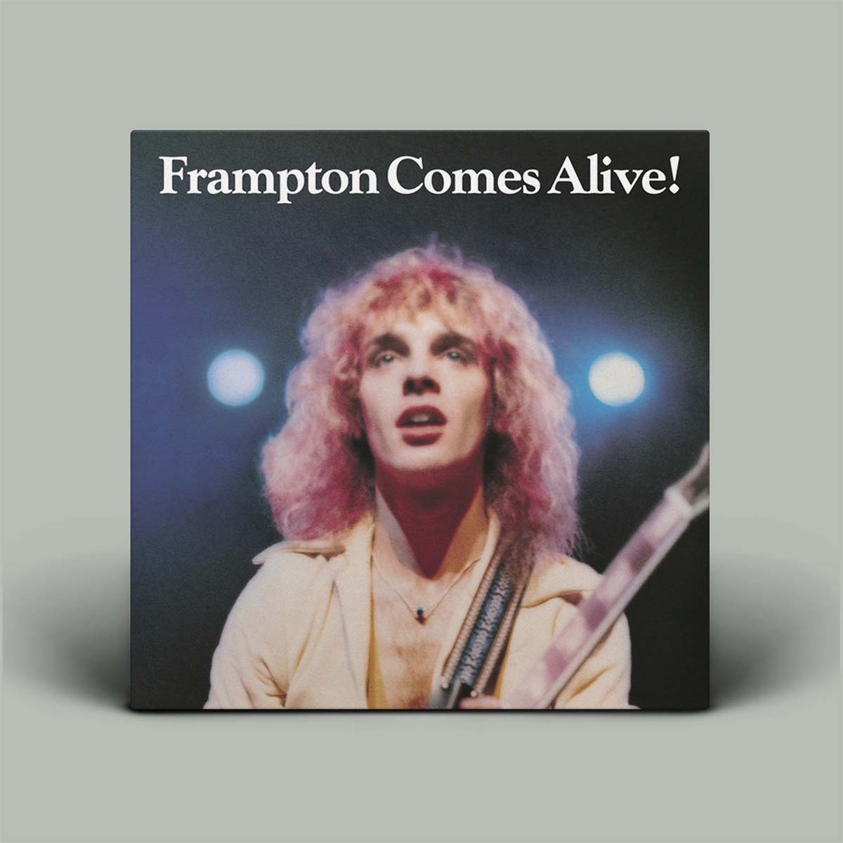  Vinyl record sleeve for 'Frampton Comes Alive!' featuring an image of a person with a pink hair and a guitar.