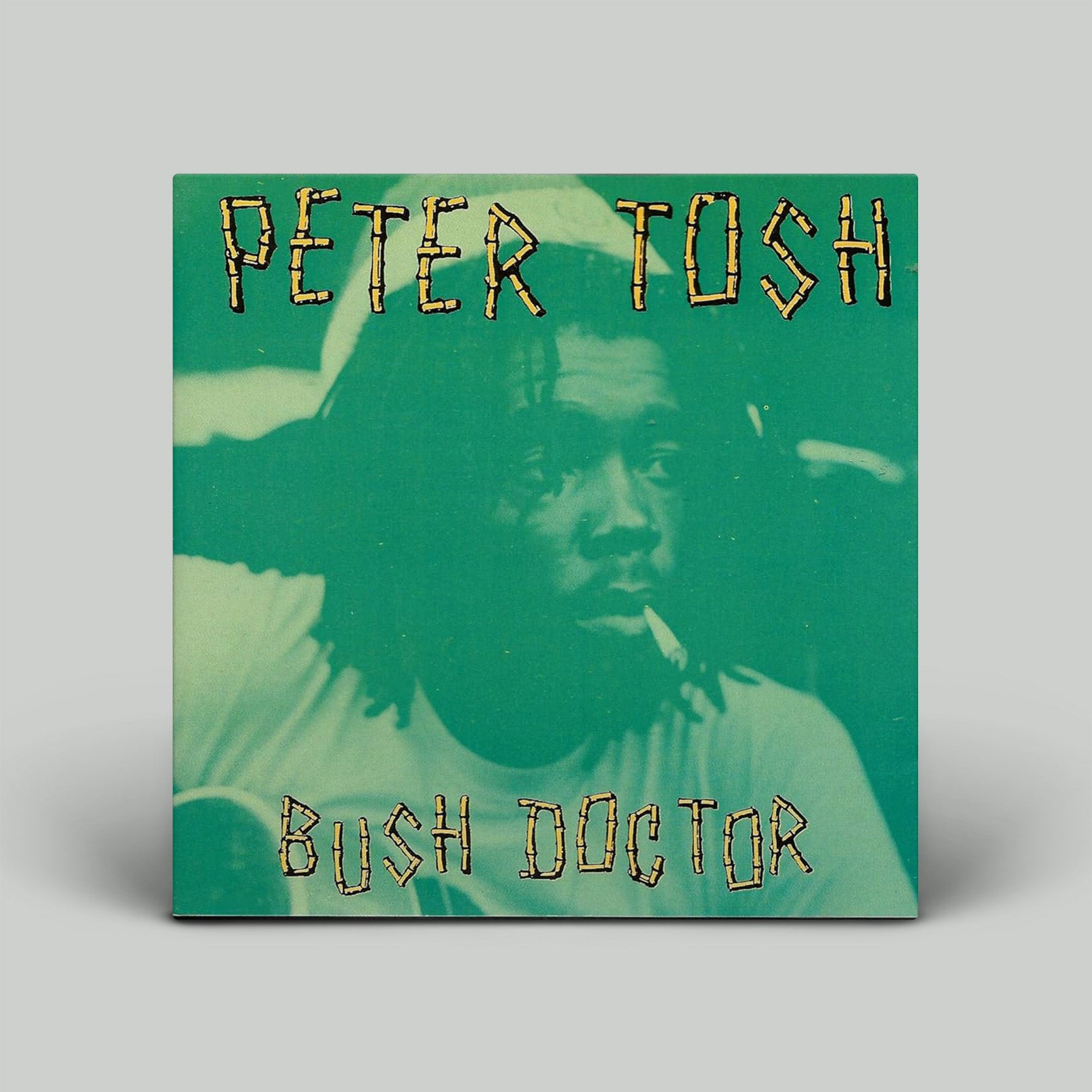 Album cover of 'Bush Doctor' by Peter Tosh with a green background and text.