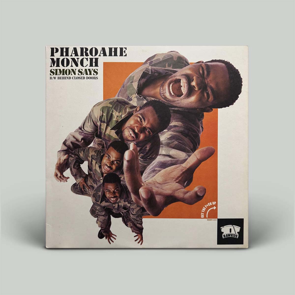 The vinyl record album cover for 'Pharoahe Monch - Simon Says' is shown standing upright on a light gray background. The cover features a stylized collage of four men in camouflage uniforms against an orange and beige background, with the artist and album title printed in bold black text at the top.