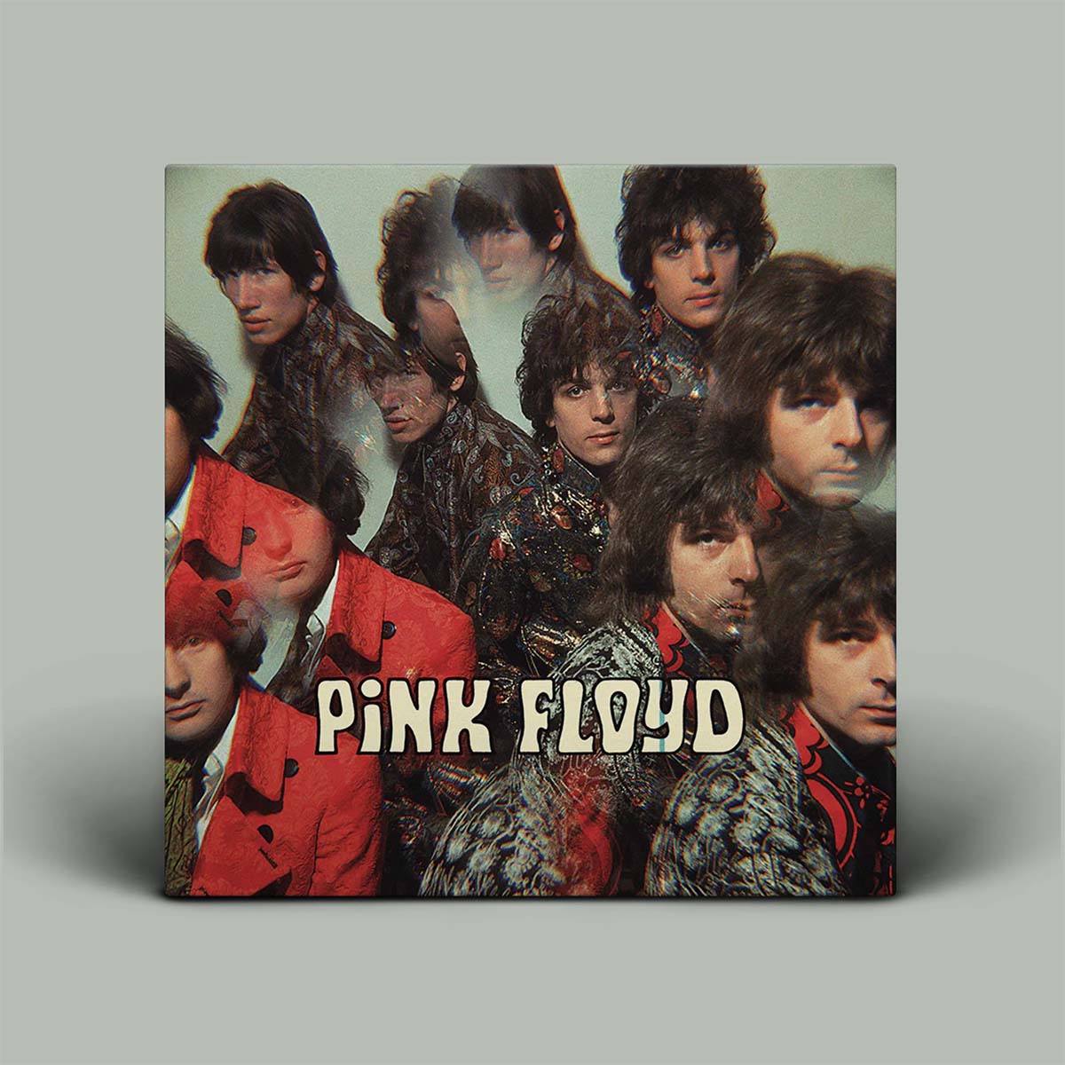 Album cover of Pink Floyd with band members' faces and the band name.