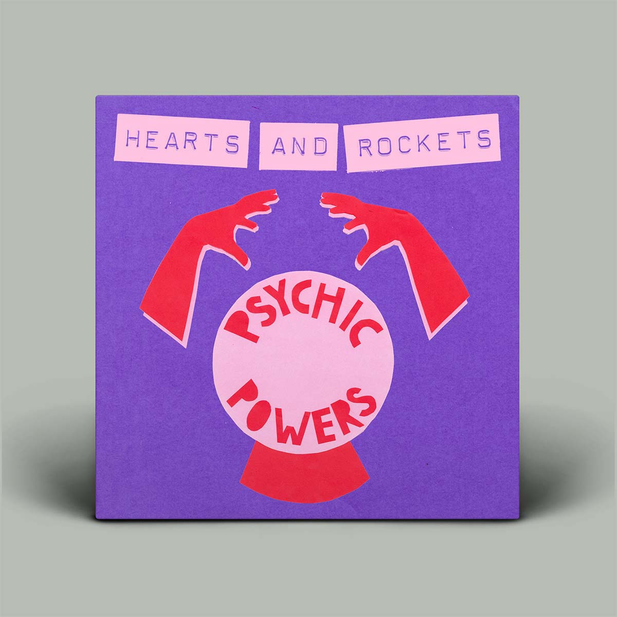 Album cover with 'Hearts and Rockets' and 'Psychic Powers' text on a purple background