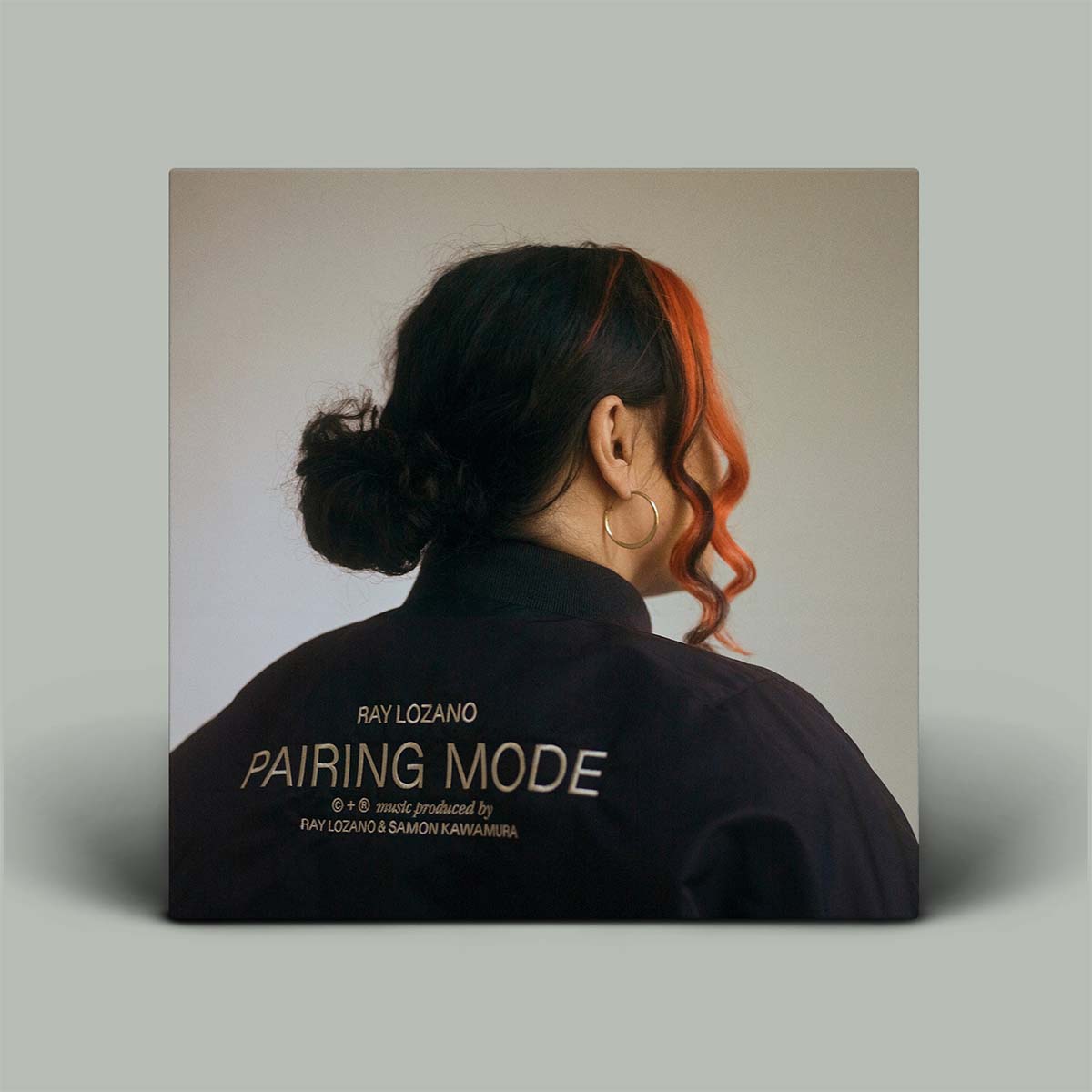 Album cover with a person's profile and 'Pairing Mode' text