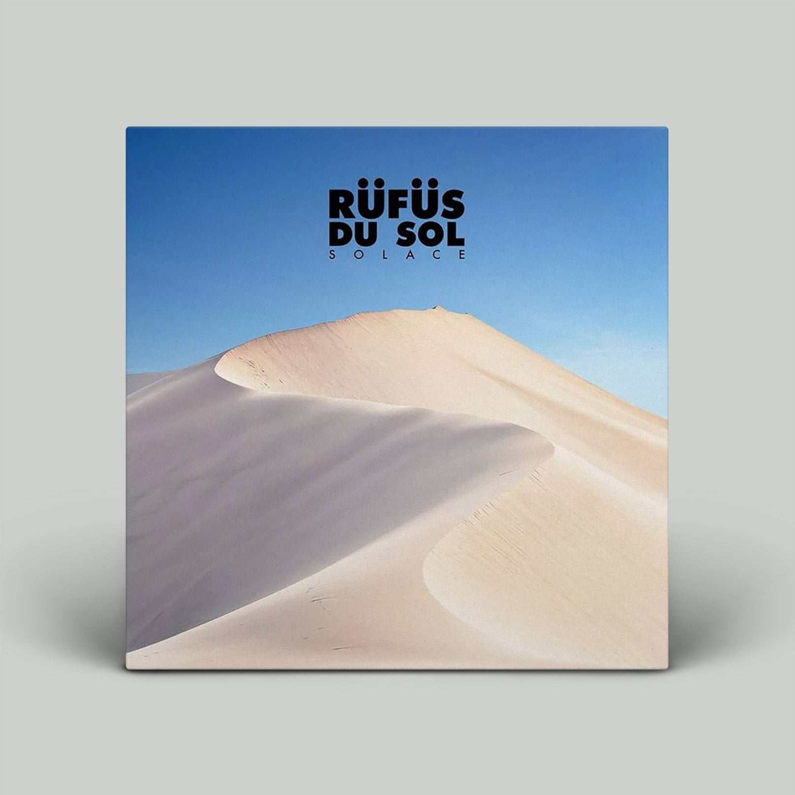 Album cover with sand dunes and blue sky, featuring the text 'Röufüs du Sol'.