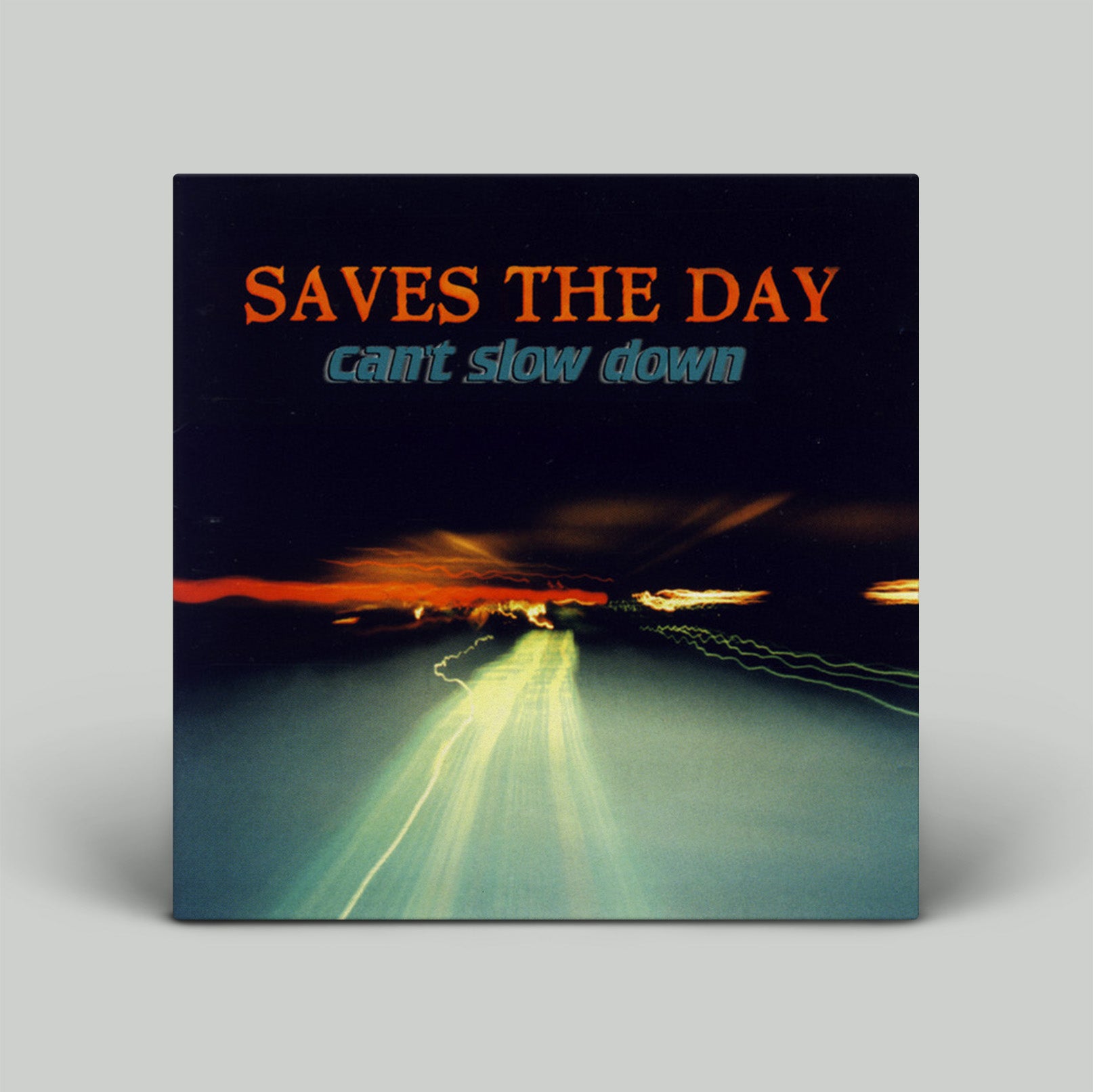 Album cover for 'Can't Slow Down' by Saves the Day with a road and sunset design.