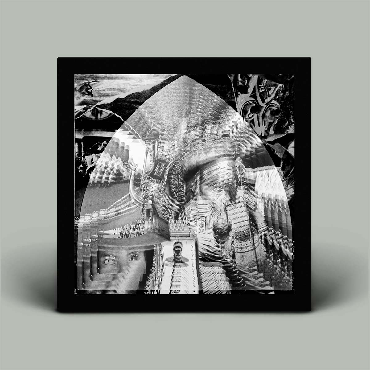 Framed black and white abstract art on a gray background