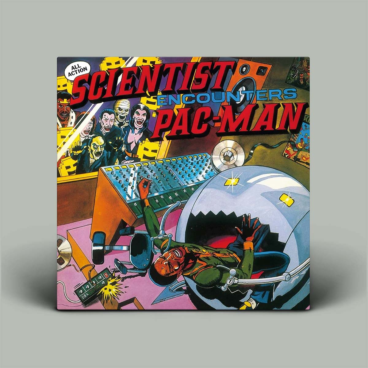 A square album or book-style cover titled 'Scientist Encounters Pac-Man' shown standing against a plain light gray background. The cover features colorful retro comic-style artwork with a character in a space suit, a mixing board, and bold red and blue title text.