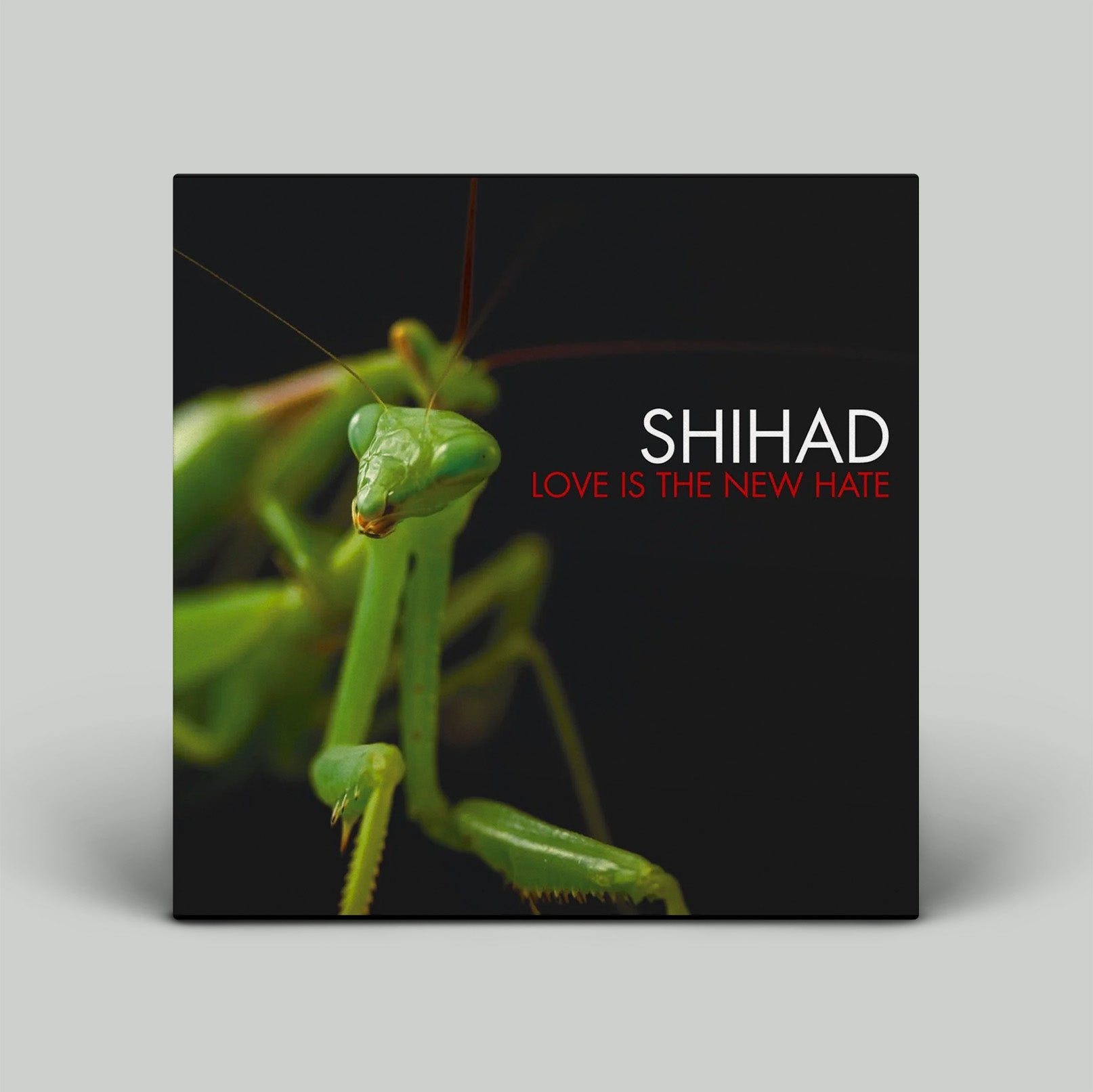 Album cover with a green praying mantis and 'SHIHAD LOVE IS THE NEW HATE' text on a black background