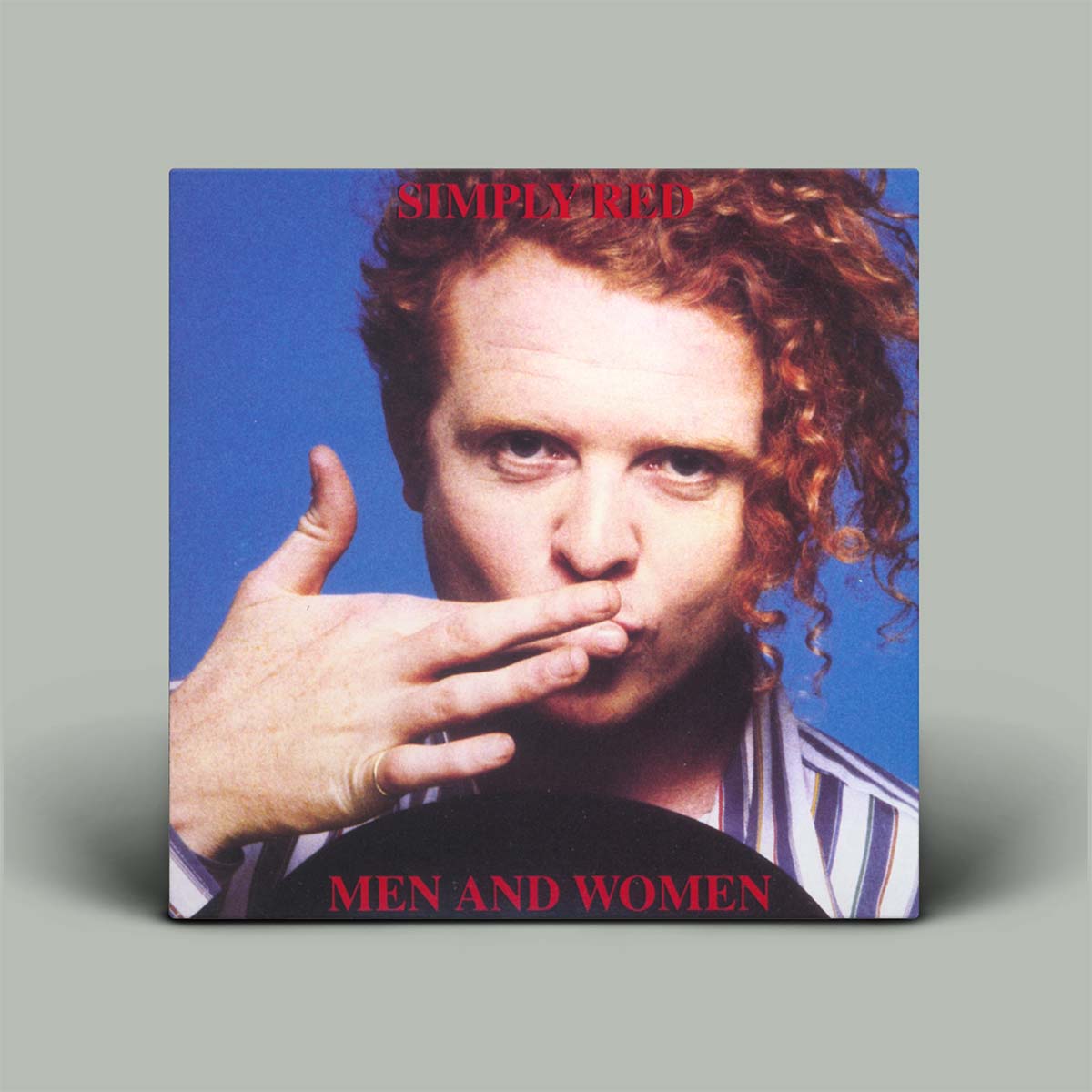 Album cover of 'Men and Women' by Simply Red with a person and hand gesture on a blue background.