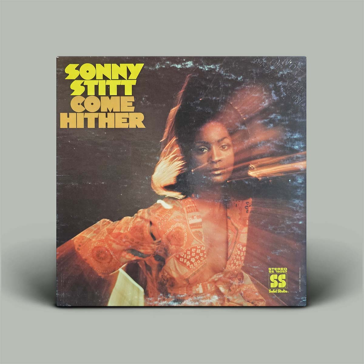 Album cover with photo pf woman in orange dress and the words Sonny Stitt - Come Hither on it.