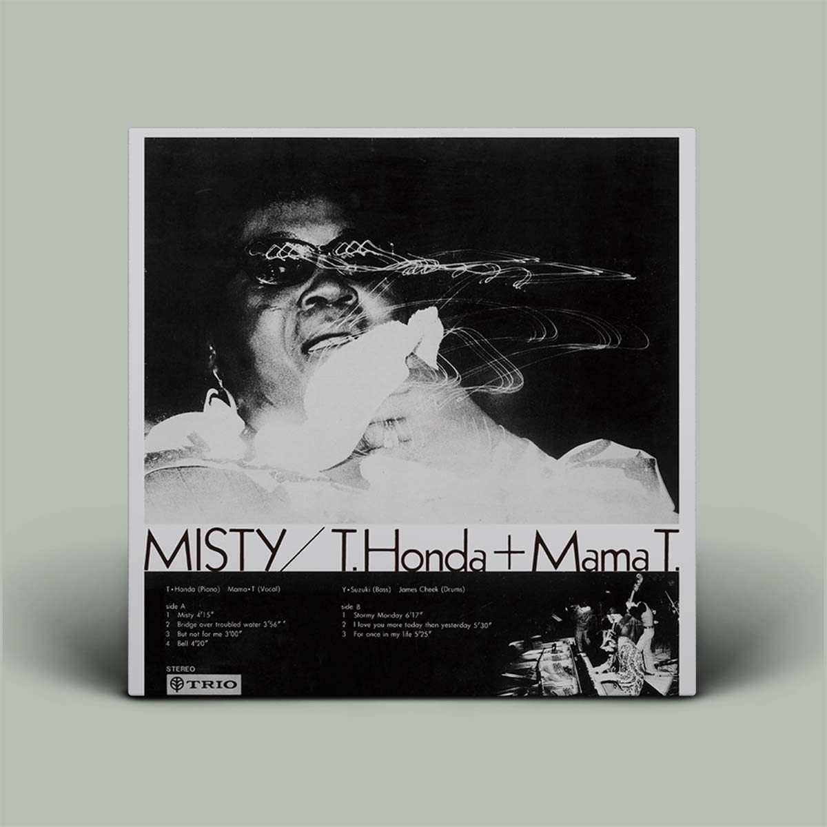 Album cover with a black and white photo of a person wearing sunglasses and a white outfit, with text at the bottom.