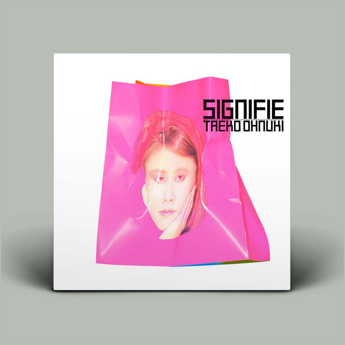 Album cover with a pink bag and person's face, featuring the text 'SIGNIFIE TAEKO OHNUKI'.