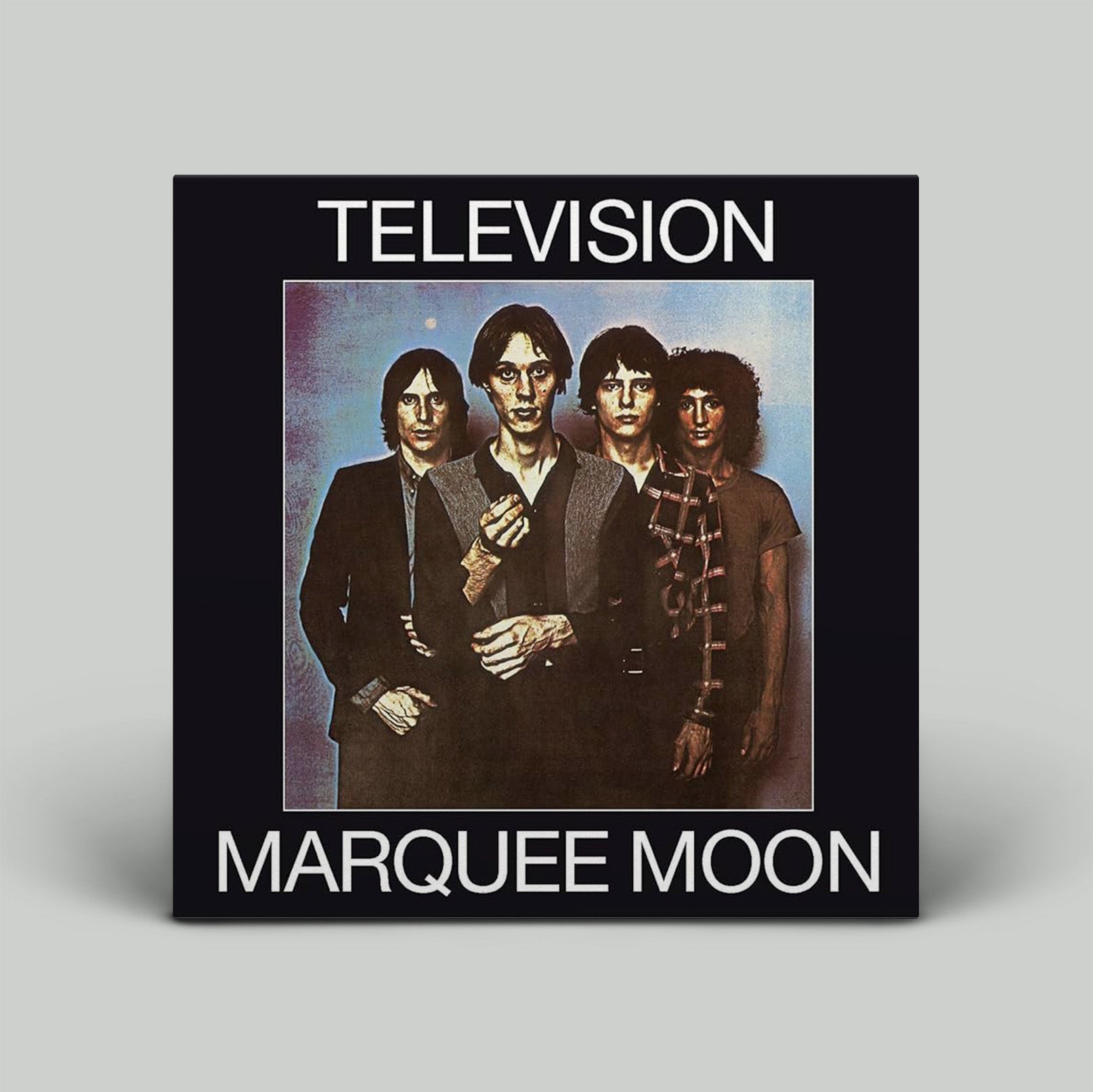Album cover for 'Marquee Moon' by Television with four band members on a black background.