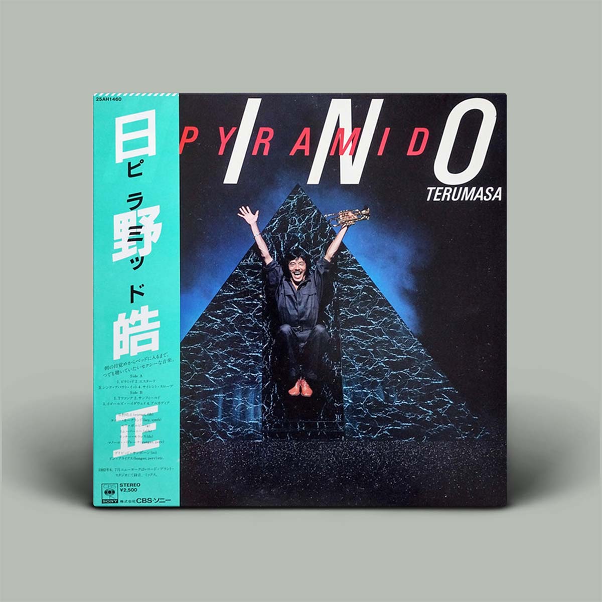 Album cover with a person inside a pyramid and text on a gray background