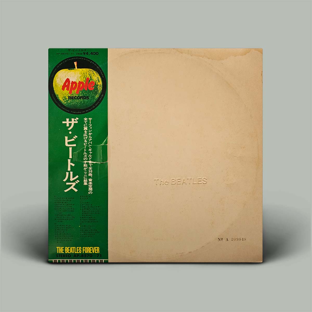 Album cover with green and beige sections, featuring the Apple Records logo and 'The Beatles' text.