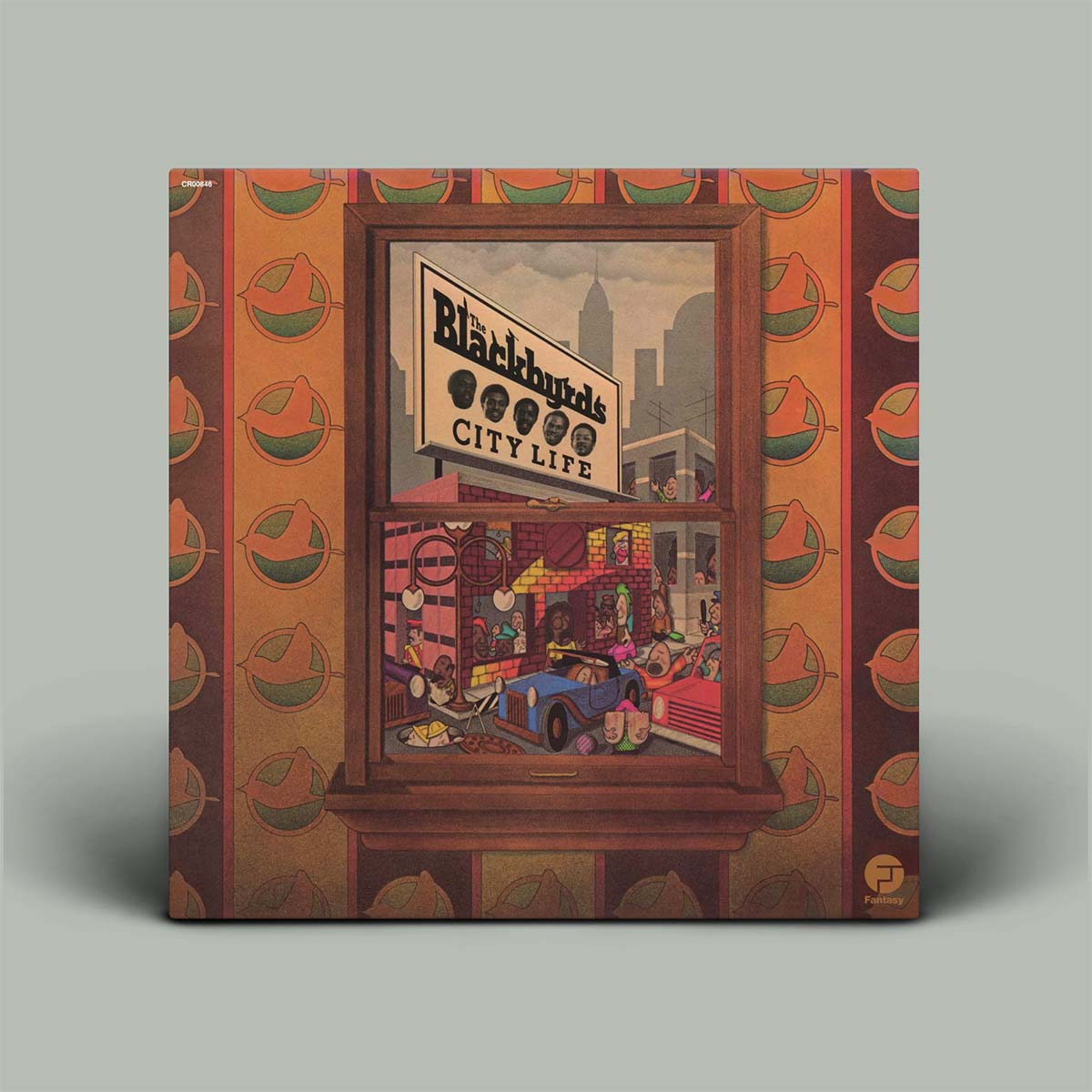 A square vinyl record sleeve for Blackbyrds' City Life, featuring a detailed illustrated storefront window scene with a blue car and city skyline, set against a patterned orange and green border on a light gray background.
