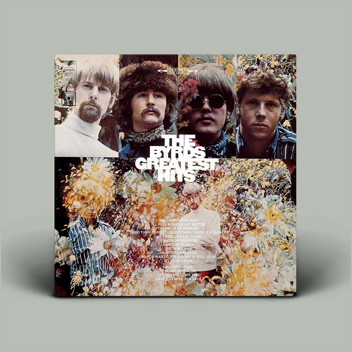 Album cover for 'The Byrds Greatest Hits' with band members' portraits and floral elements on a gray background.