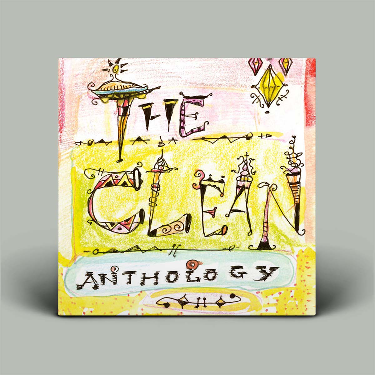 Album cover of 'The Clean Anthology' with artistic design elements on a gray background