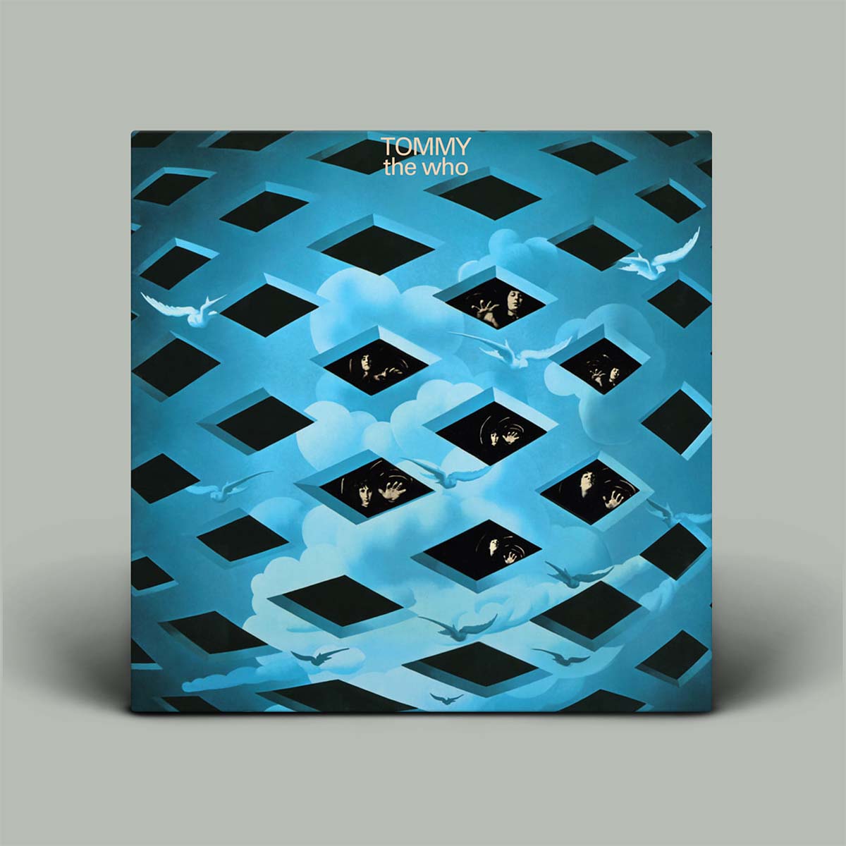 Album cover for 'Tommy' by The Who with geometric pattern and blue color scheme.