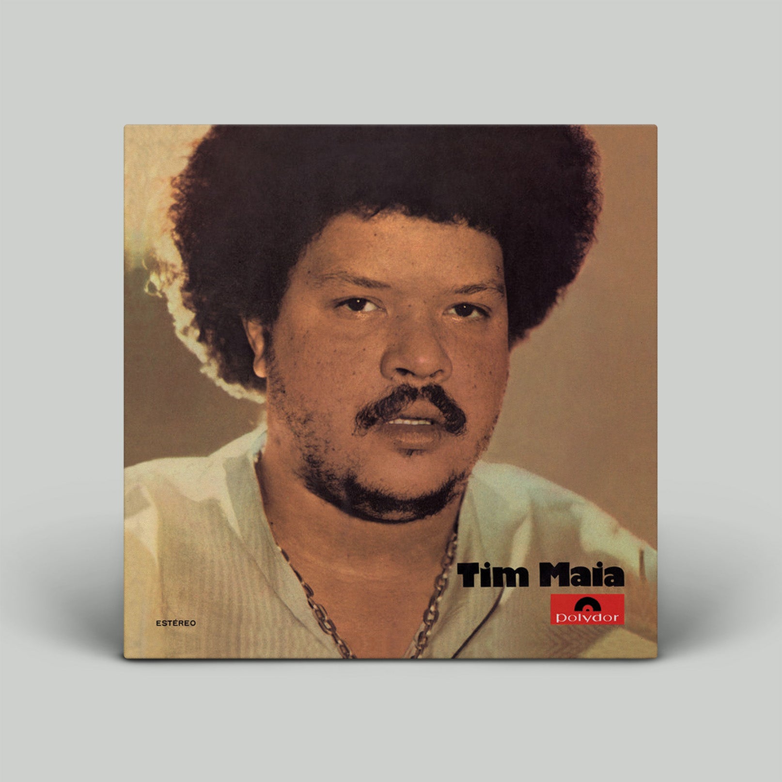 Album cover featuring a portrait of a person with text and a logo on a beige background