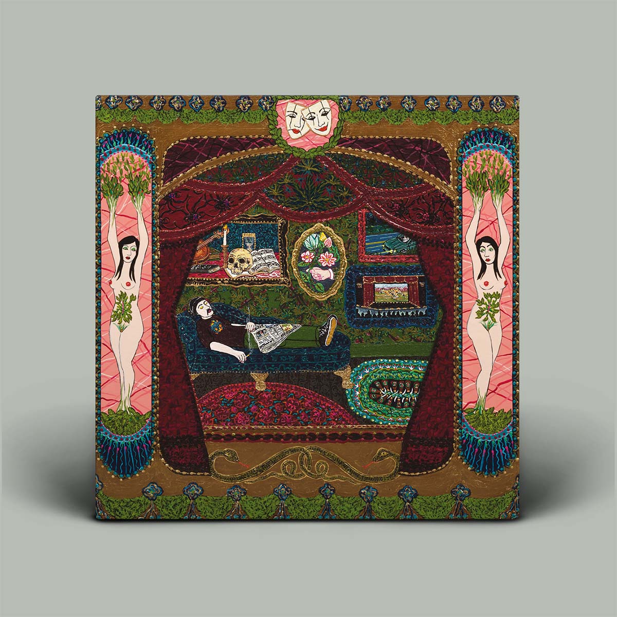 Album cover featuring decorative panel with artistic design featuring women, a skull, and various elements on a gray background