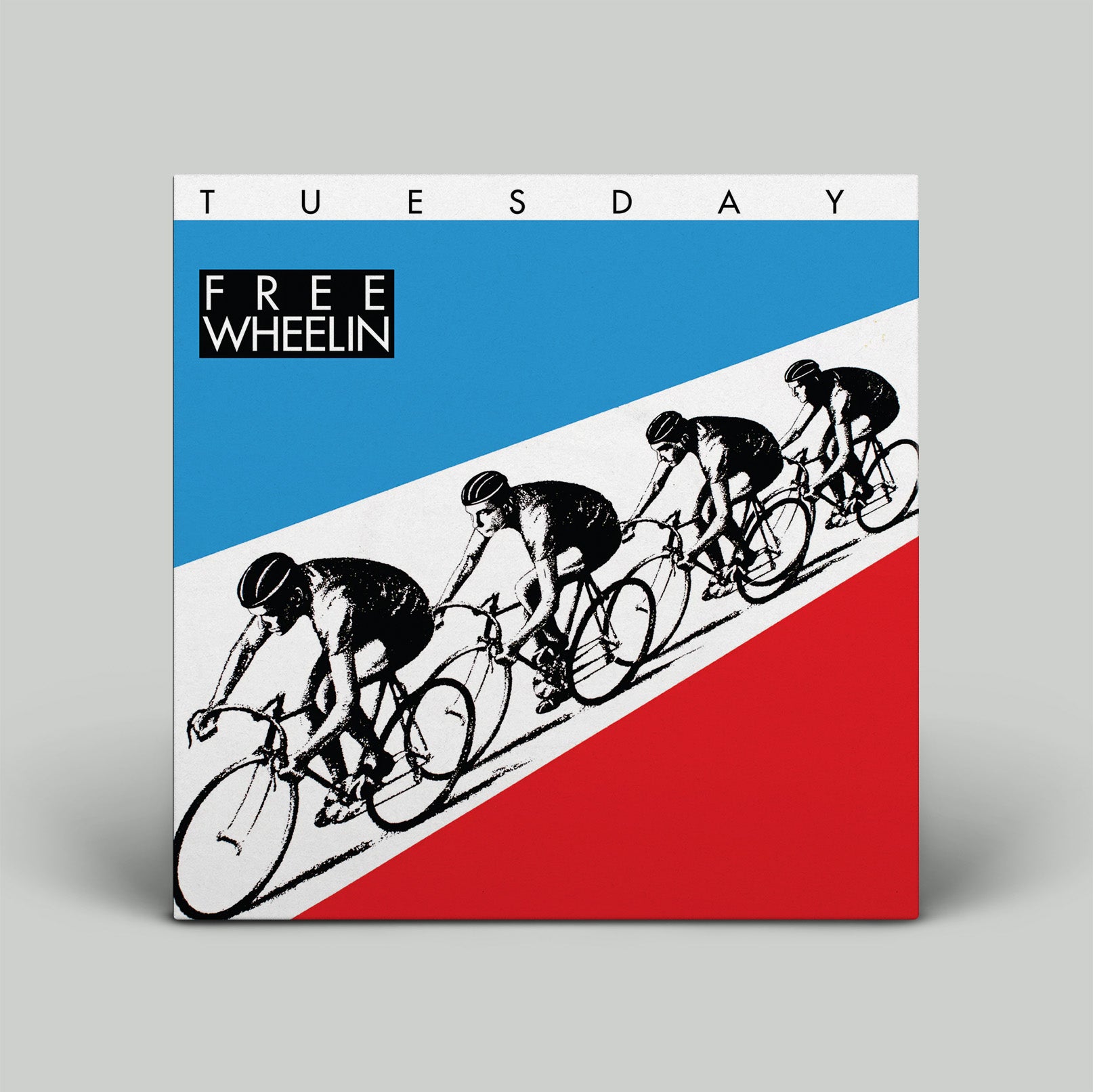 Album cover with cyclists and 'Free Wheelin'' text on a red, white, and blue background