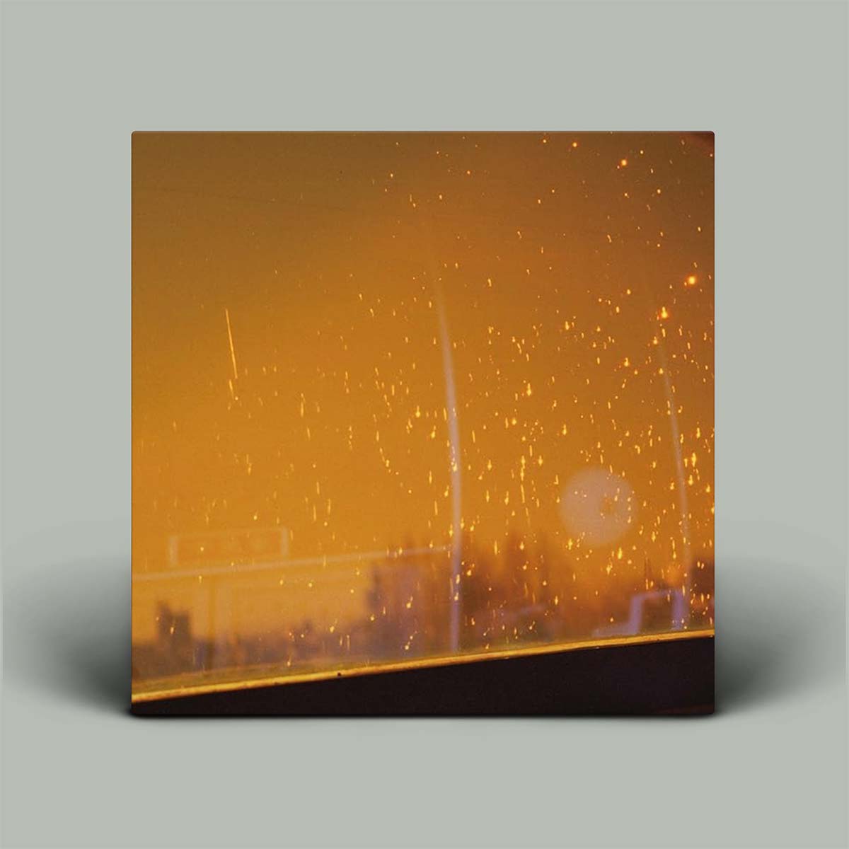 Album cover featuring an orange photo of a sky.