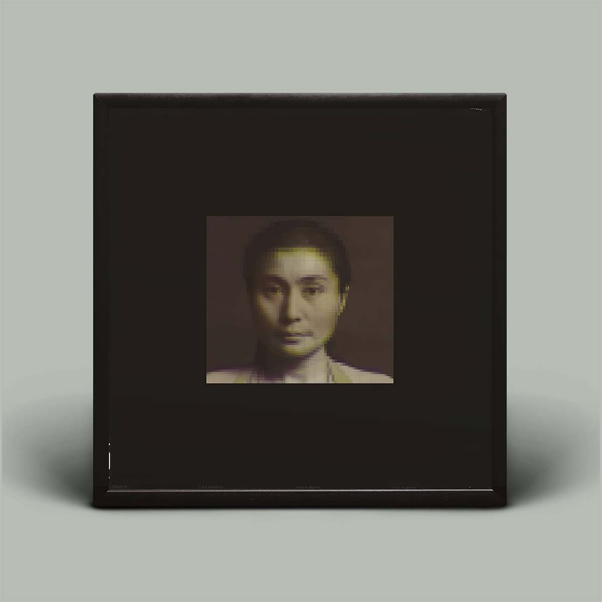 Album cover with small photo in the centre of Yoko