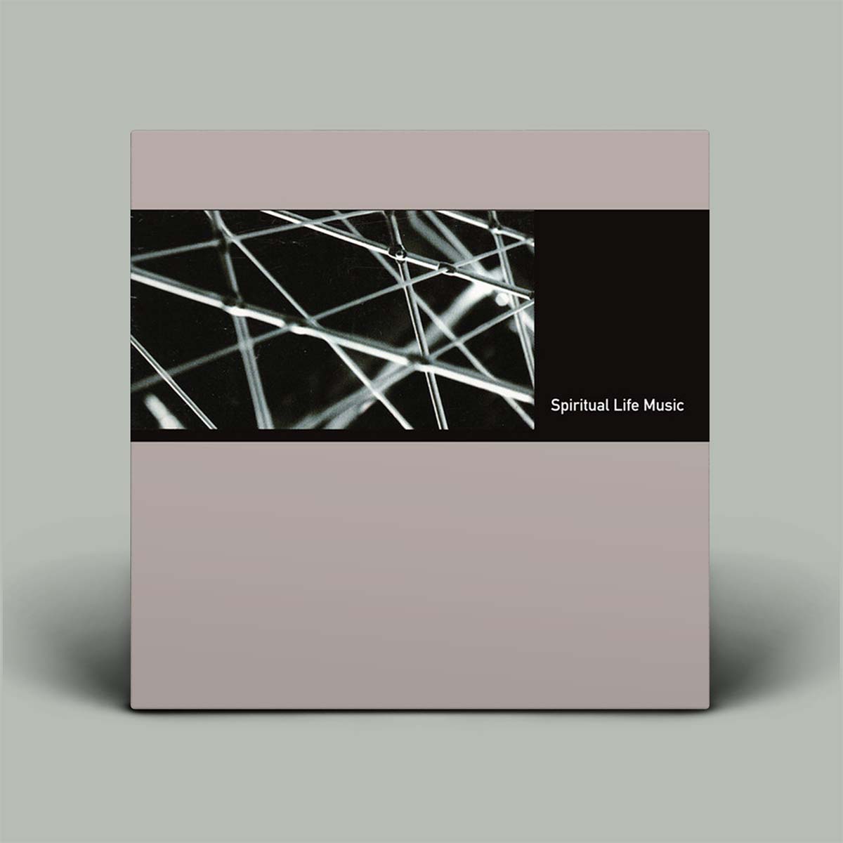 Album cover with abstract design and 'Spiritual Life Music' text on a gray background