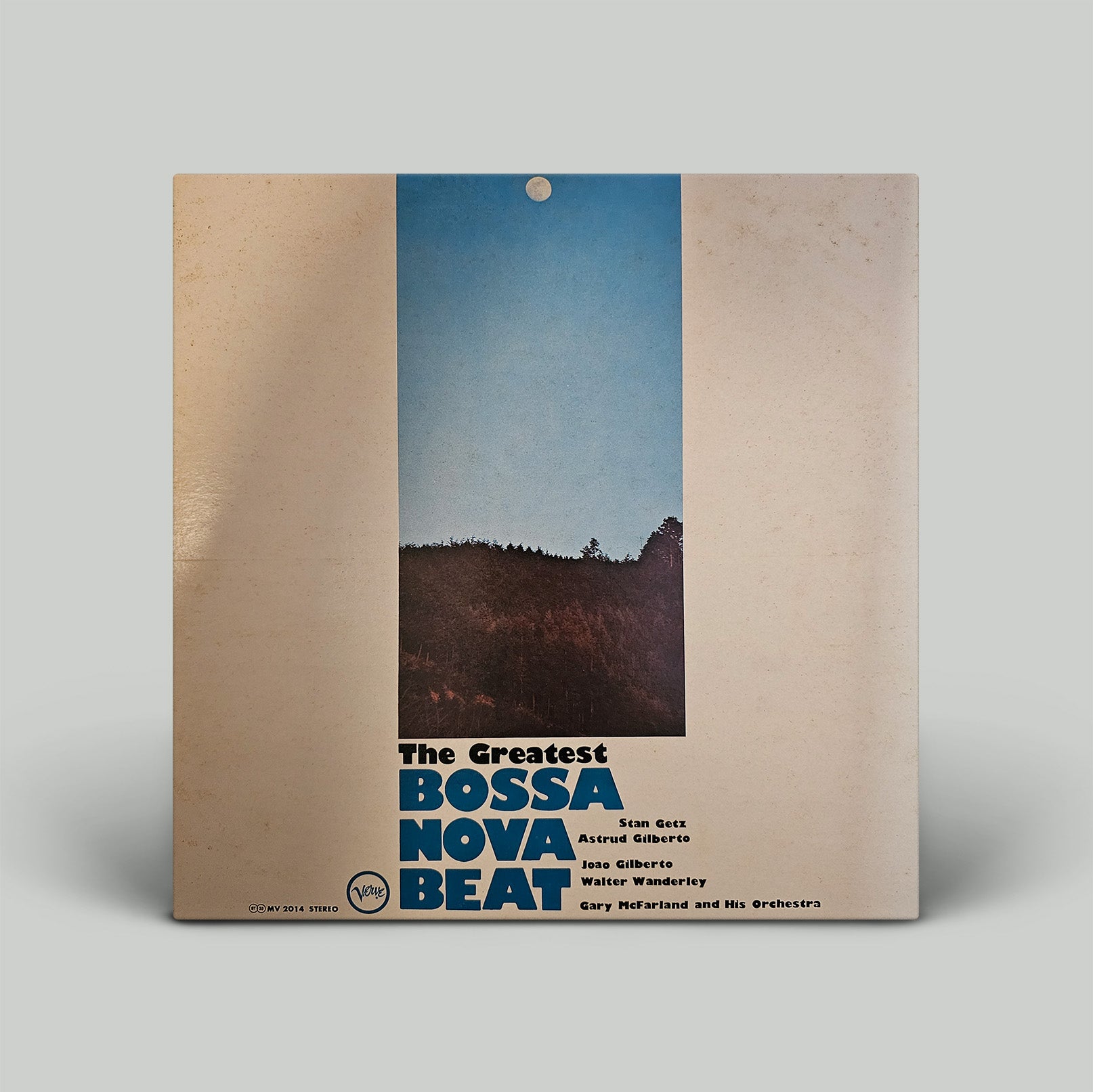 Vinyl record cover with a mountain landscape and text 'The Greatest Bossa Nova Beat' on a beige background.