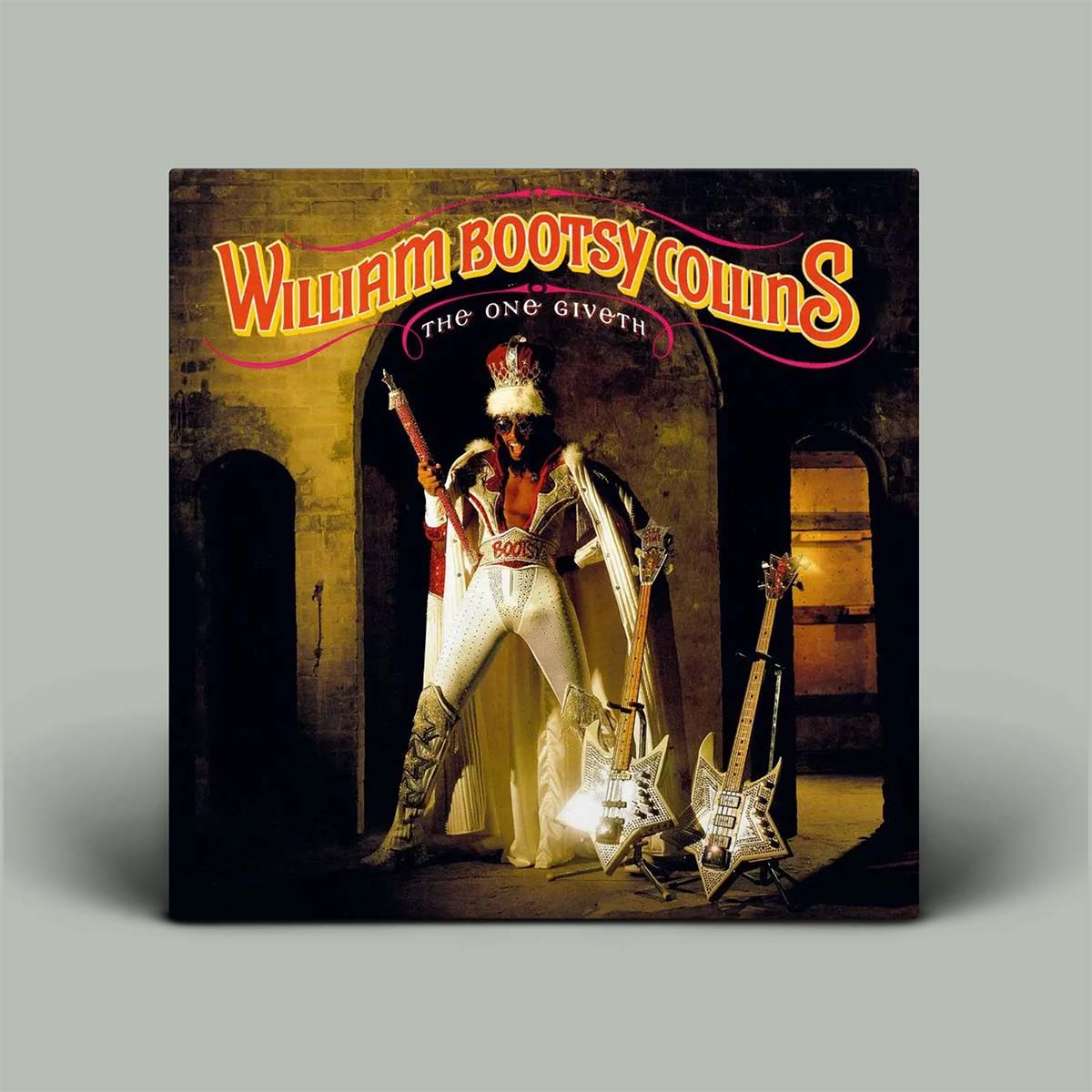 William Bootsy Collins 'The One Giveth' vinyl record cover shown as a square album sleeve against a plain light gray background.
