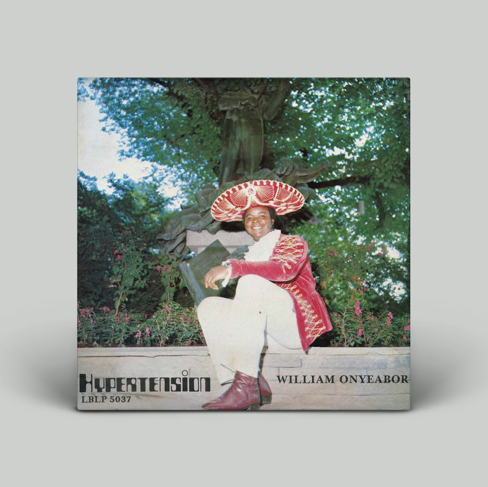 Album cover of 'Hypertension' by William Onyeabor with a person sitting on a bench in a garden.