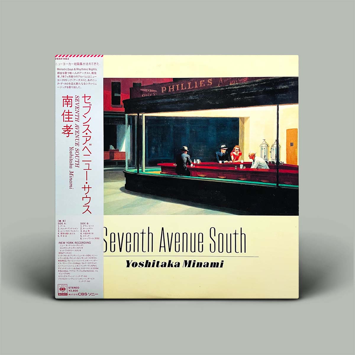 The album cover of Yoshitaka Minami's 'Seventh Avenue South' in Japanese edition, displayed on a neutral gray background. The cover features a cream-colored background with a central illustration of a diner scene and a white spine strip with red and black text.
