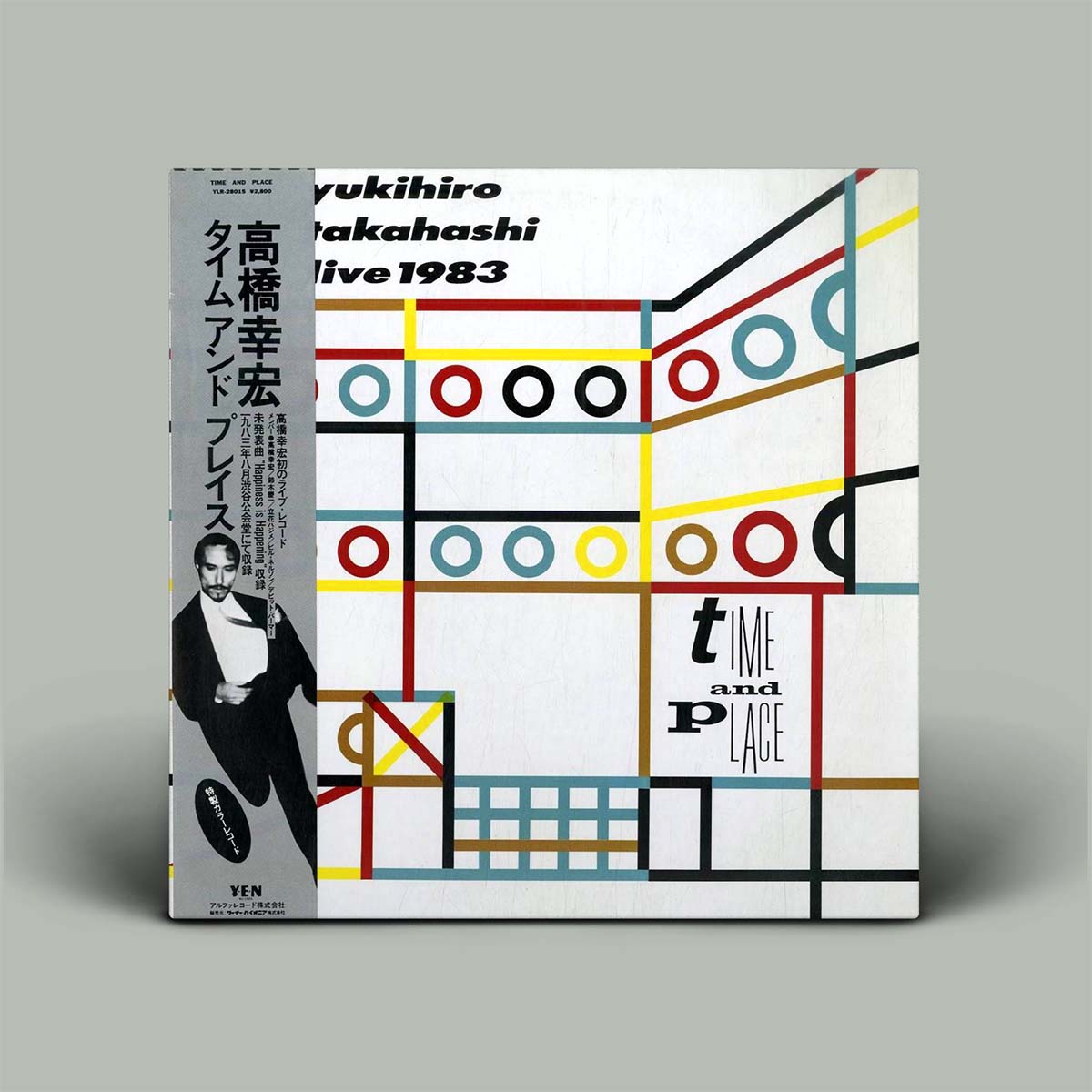 Album cover with geometric design and text on a gray background