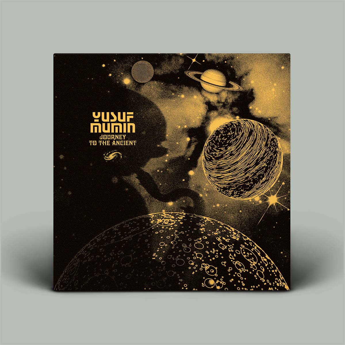 Album cover with space-themed design and 'Yusuf Mumtaz' text on a gray background