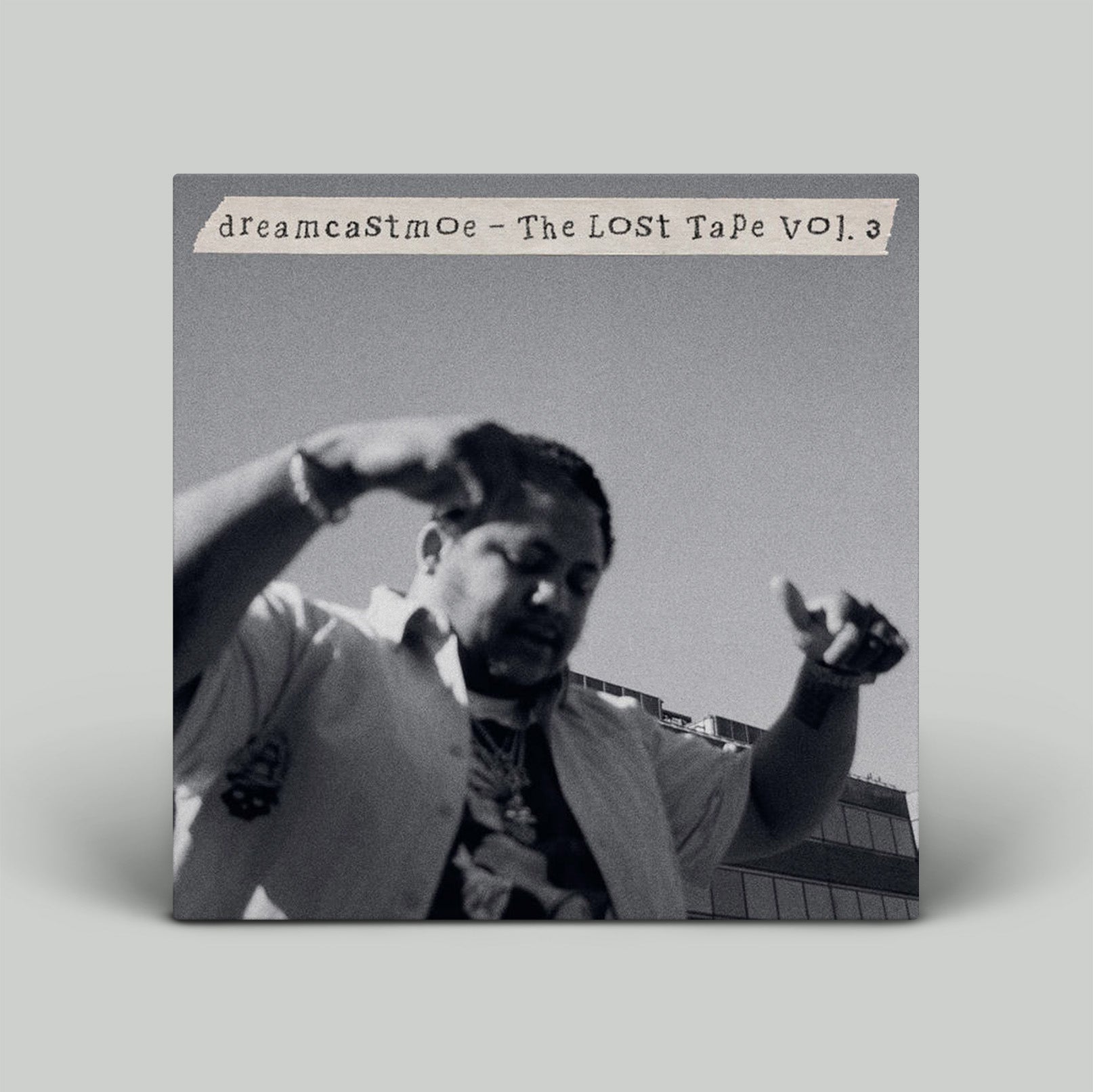 Album cover for 'The Lost Tape Vol. 3' by dreamcaStmoe with a black and white photo of a person on a gray background.